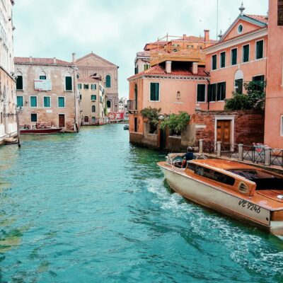 Picturesque view of Venice's canals with charming architecture and traditional boat.